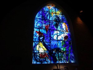 Interior of Union Church - stained glass window designed by artist, Marc Shagall.